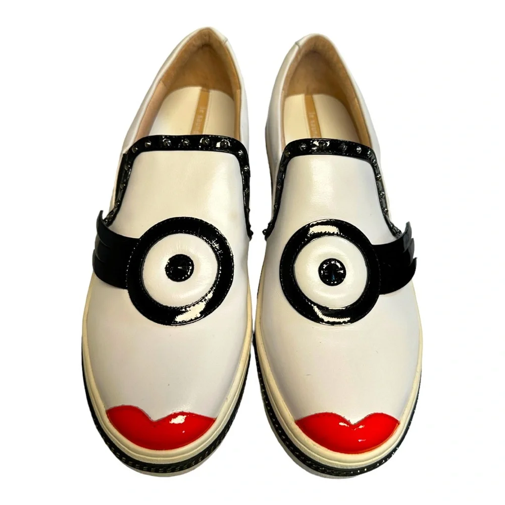 White Leather Slip-On Sneakers with Black Trim and Red Accent